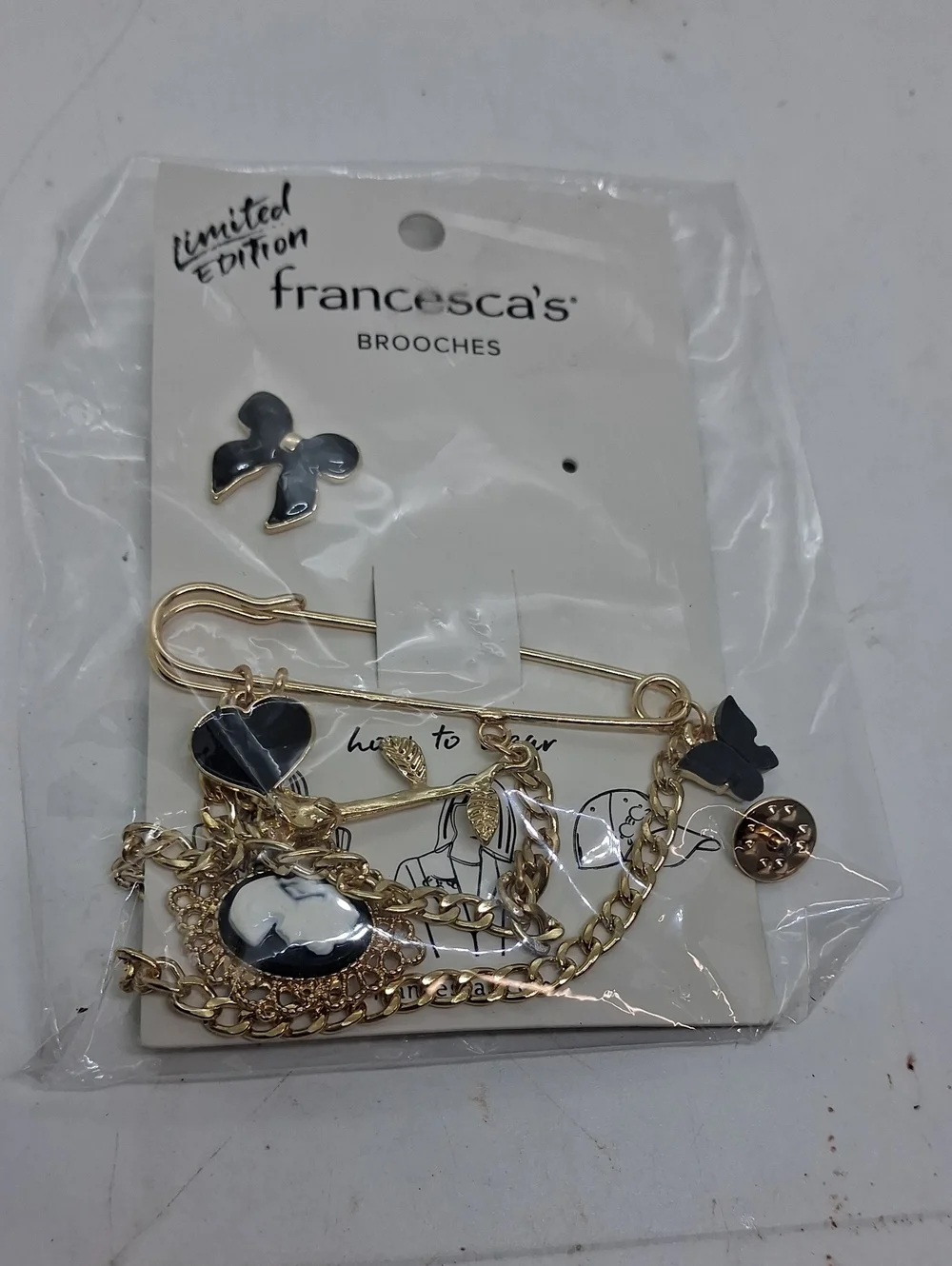 NWT Womens Francesca's Collections Gold and Black Multi-Charm Brooch Set